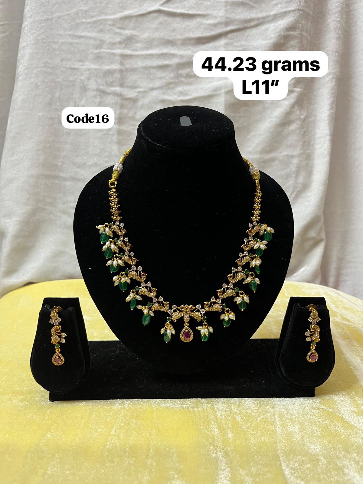 Panchaloha made gold polished green stone pearl necklace-https://s3.ap-south-1.amazonaws.com/prod-media-vyaparify-com/vcards/products/70363/acd07651-1d22-48b1-a07b-19dedbc4054a.jpg Image