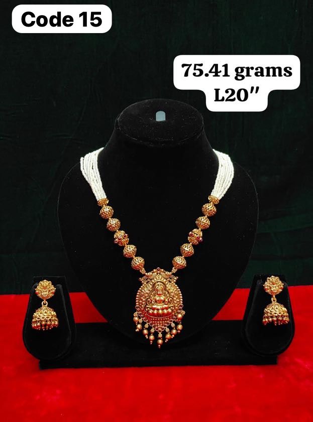 Panchaloha made gold polished lakshmi nakas gundu pendant with white bead chain along with earrings-https://s3.ap-south-1.amazonaws.com/prod-media-vyaparify-com/vcards/products/73053/d2d86d99-dbea-47f9-8ab6-db26d9ca8001.jpg Image