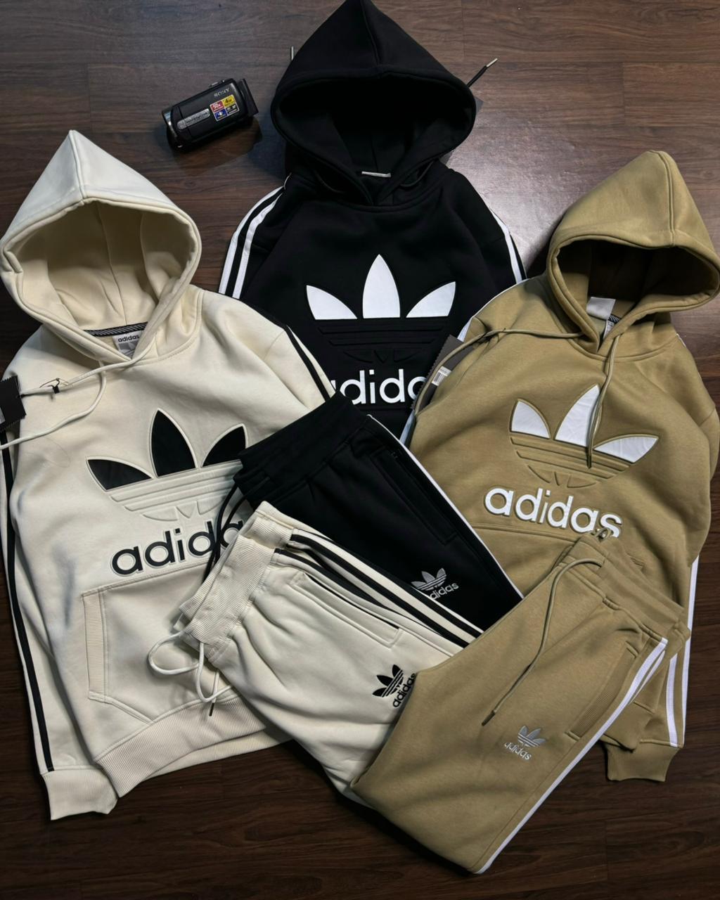 Adidas Tracksuit-https://s3.ap-south-1.amazonaws.com/prod-media-vyaparify-com/vcards/products/88569/808fe647-d4cd-4286-9a5a-9af1b3ce154a.jpeg Image