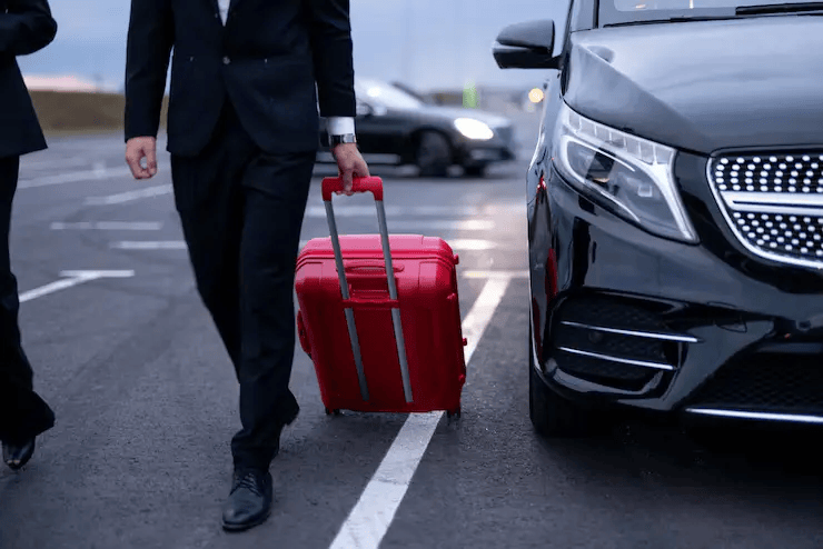 business-couple-walking-with-suitcase-parking-lot_506452-23512-1.png