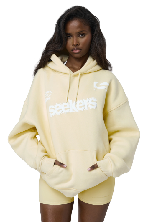 Sisters-and-Seekers-Motif-Hoodie-in-Butter-Yellow-1.png