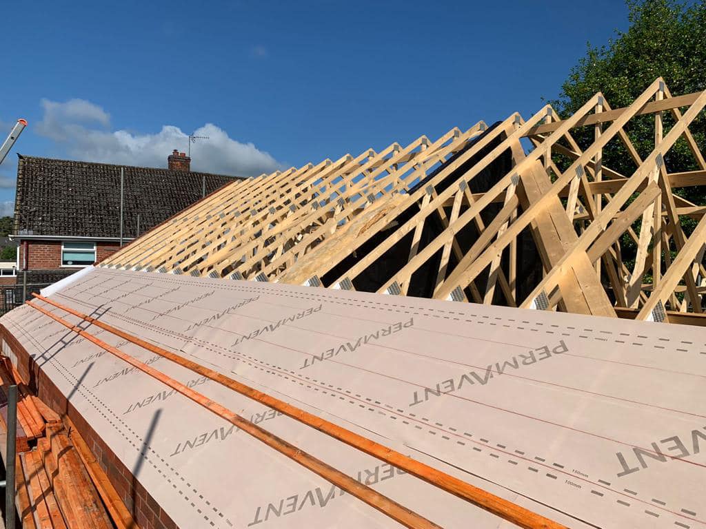 How do I assess the cost of flat roofing versus traditional roofing in Shropshire?