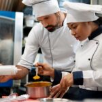 Student learning patisserie and bakery skills during a culinary internship in France.