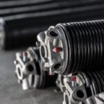 Why Your Garage Door Springs Are Designed to Break After 10,000 Uses