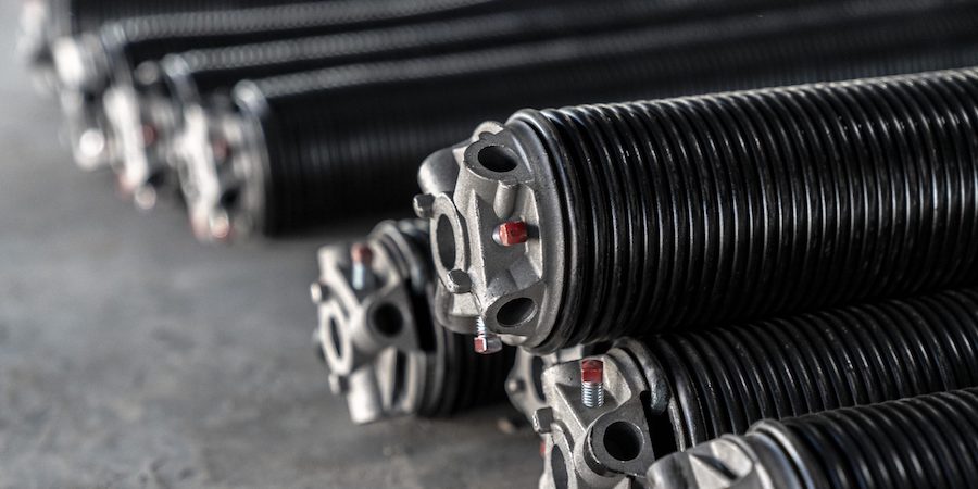 Why Your Garage Door Springs Are Designed to Break After 10,000 Uses