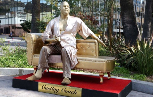 Gold Weinstein statue in bathrobe at Oscars