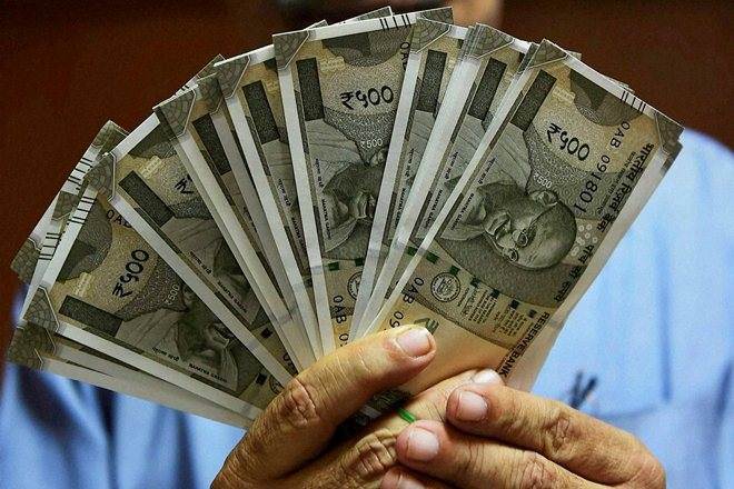 Rupee slips 14 paise to 71.11 against USD in early trade