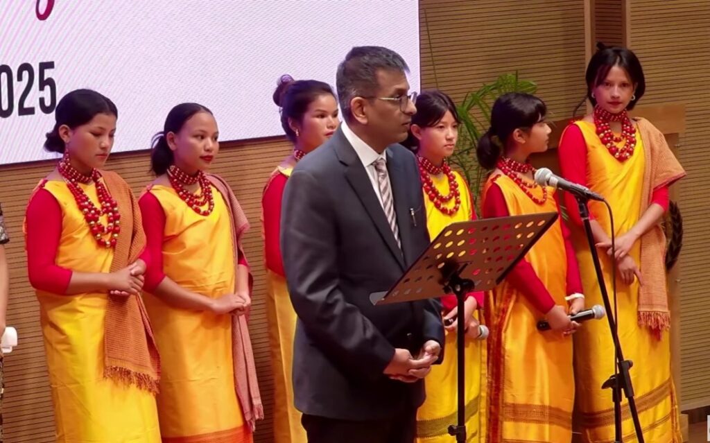 Ex CJI Dr Chandrachud flanked by students 