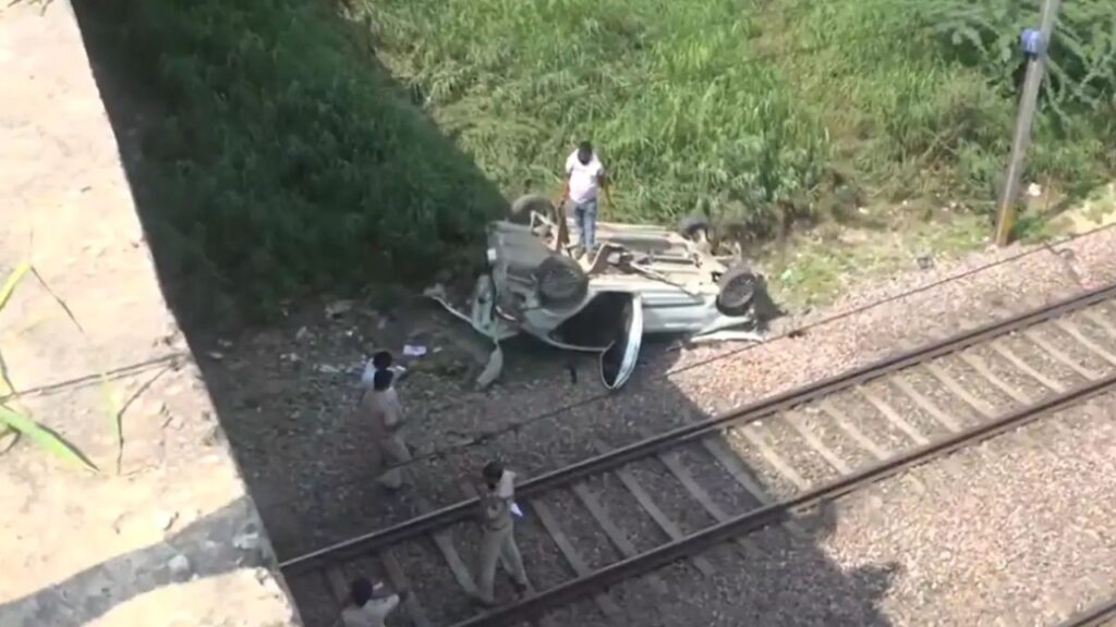 Car falls off flyover on railway tracks