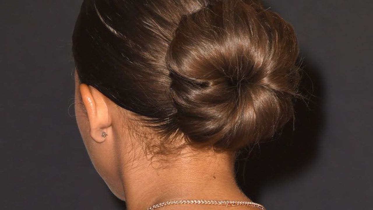 Classic Low Bun: A sleek low bun paired with a traditional saree or lehenga adds elegance and sophistication. Perfect for weddings and festive gatherings, it can be accessorized with flowers or jeweled pins. Classic Low Bun: A sleek low bun paired with a traditional saree or lehenga adds elegance and sophistication. Perfect for weddings and festive gatherings, it can be accessorized with flowers or jeweled pins.
