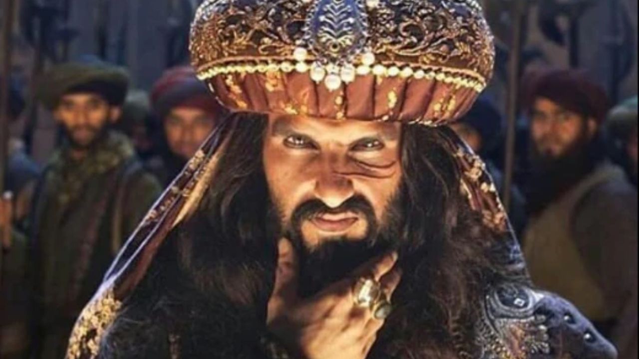 Alauddin Khilji in Padmaavat: This look was a powerful transformation into a menacing, medieval-era antagonist. The long, unkempt hair and beard, light-colored contact lenses, and heavy, raw-fabric costumes created an intimidating and barbaric appearance that became iconic. Alauddin Khilji in Padmaavat: This look was a powerful transformation into a menacing, medieval-era antagonist. The long, unkempt hair and beard, light-colored contact lenses, and heavy, raw-fabric costumes created an intimidating and barbaric appearance that became iconic.