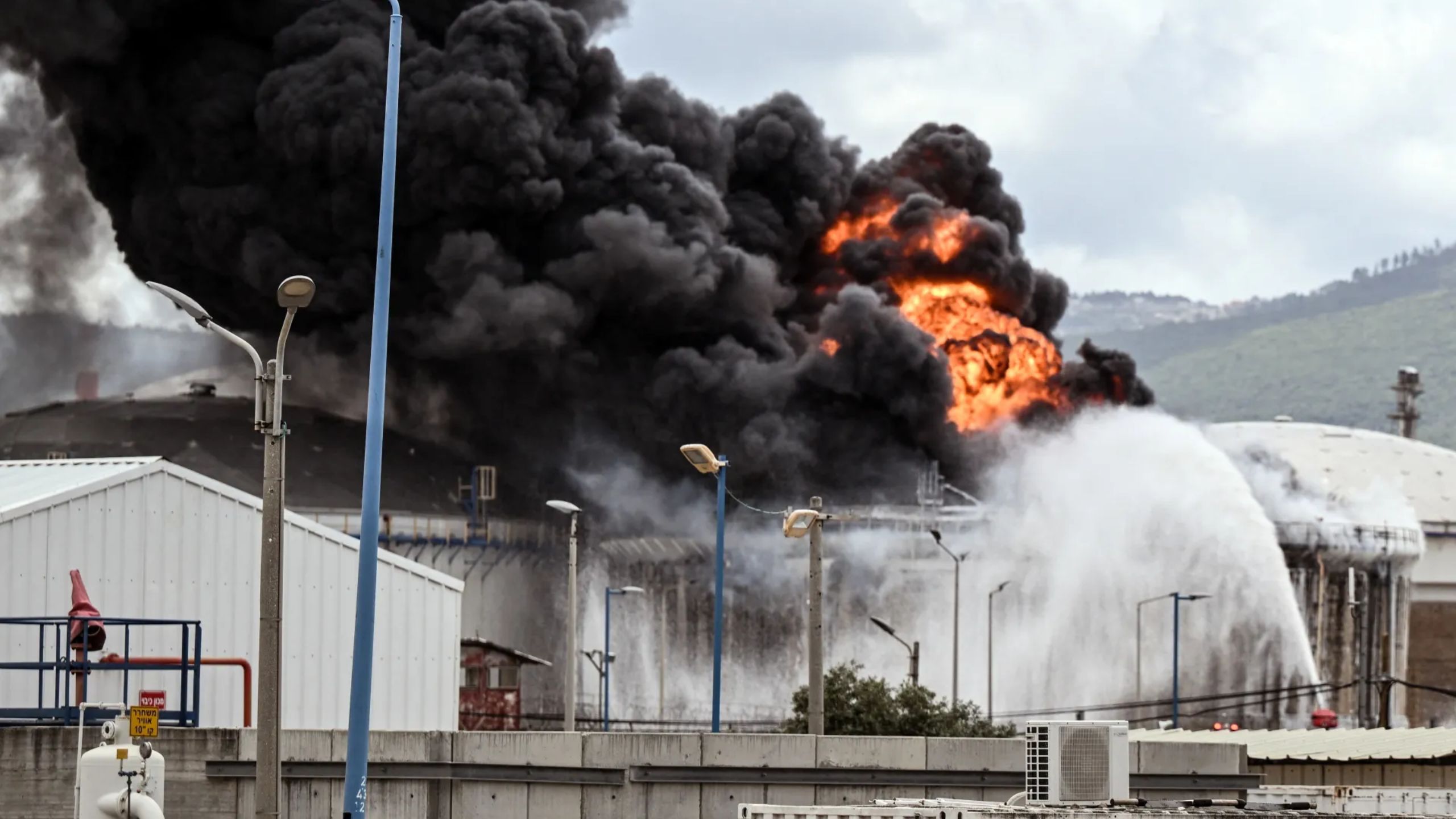 Iran and Hezbollah launch coordinated strikes on Israel; Haifa refinery and naval base targeted