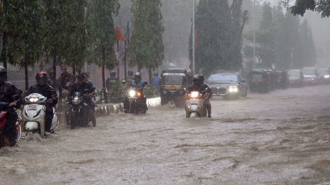 Mumbai Rains Trigger Flight Delays, Flood Roads, Disrupt Daily Life; IMD Retains Red Alert