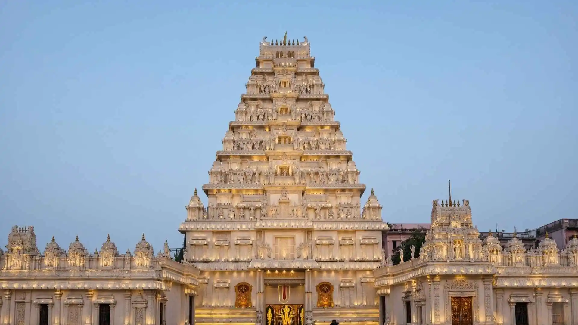 Sree Bhumi Sporting Club in Lake Town is among Kolkata’s most talked-about Durga Puja destinations, renowned for its grand installations and larger-than-life pandal designs. The club once drew widespread attention by recreating the opulent world of Mahishmati, inspired by the film Baahubali, transforming the venue into a spectacular setting reminiscent of a cinematic palace. Intricate detailing, elaborate decorations and dramatic lighting are hallmarks of its themed celebrations, attracting devotees, tourists and photography enthusiasts. The pandal combines artistic creativity with the festive spirit of Durga Puja, making it a popular stop for families and first-time visitors to Kolkata during Pujo. Located at Sree Bhumi Sporting Club in Lake Town, it is near the Lake Town Clock Tower, with Jessore Road Metro Station serving as a nearby transit point. Visiting after sunset, between 6:30 pm and 9 pm, offers an opportunity to experience the illuminated decorations and vibrant evening atmosphere.
