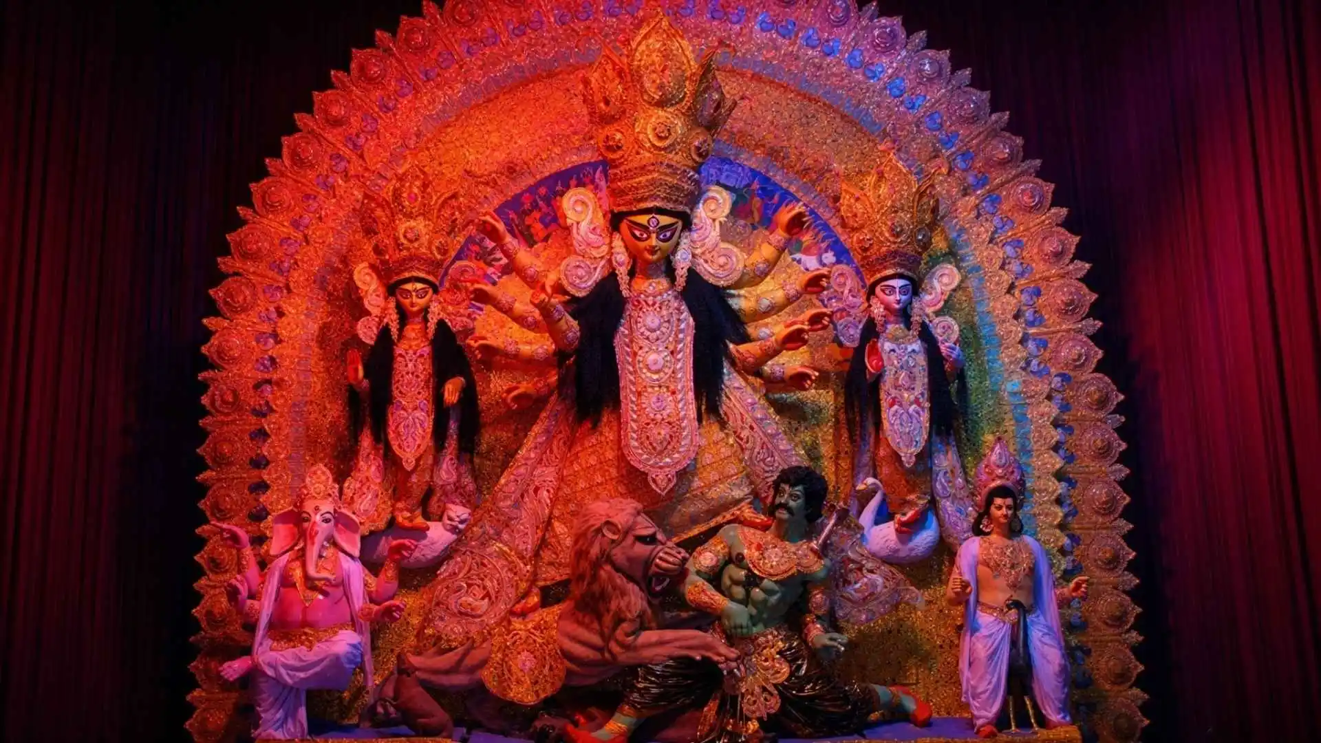 Maddox Square Durga Puja is one of Kolkata’s well-known traditional celebrations, with a history that began at the residence of Late Sri Saroh Bagchi before the puja was moved to Maddox Square Park. Over the years, it has become a popular gathering place during Durga Puja, attracting young people, families and tourists who come to enjoy the festivities and catch up with friends. The pandal’s appeal lies in its blend of traditional Bengali customs and artistic presentation, with carefully planned decorations, lighting and sound adding to the festive atmosphere. The idol of Maa Durga is crafted in the traditional style by skilled artisans associated with Kalighat, preserving the artistic heritage of the city. Located at Maddox Square Park in Ballygunge, the pandal is accessible from the surrounding Gariahat area, while Rabindra Sadan Metro Station is listed as a nearby transit option. Visitors can plan their visit between 5:30 pm and 8:30 pm to experience the evening celebrations and the lively spirit of Kolkata’s Pujo adda.