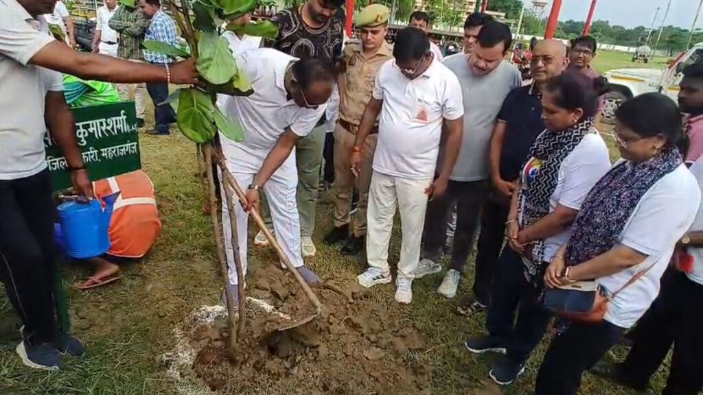 DM Santosh Kumar Sharma planting a tree