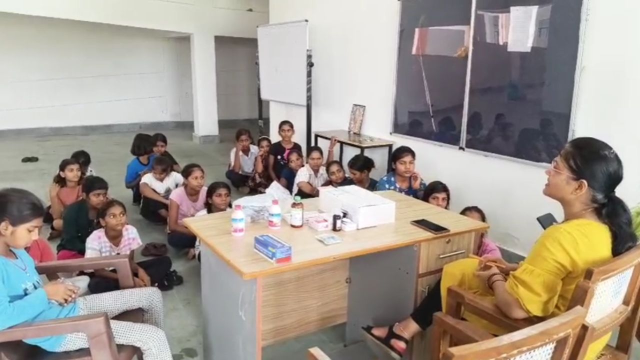 Doctor giving advice to girls