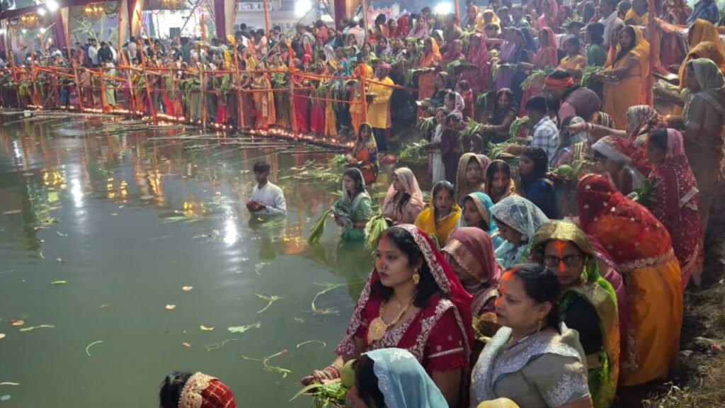 Women observing fast offer prayers to the rising sun