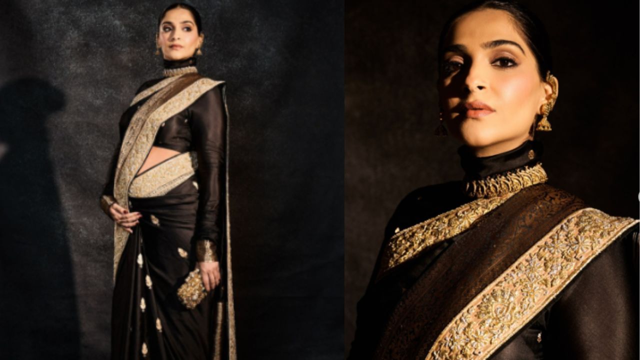 सोनम कपूर ने काले रंग की गोल्डन बॉर्डर वाली में अपनी उपस्थिति दर्ज कराई, जिसे उन्होंने पूरी आस्तीन वाले काले ब्लाउज़ के साथ पेयर किया। सोनम कपूर ने काले रंग की गोल्डन बॉर्डर वाली में अपनी उपस्थिति दर्ज कराई, जिसे उन्होंने पूरी आस्तीन वाले काले ब्लाउज़ के साथ पेयर किया।