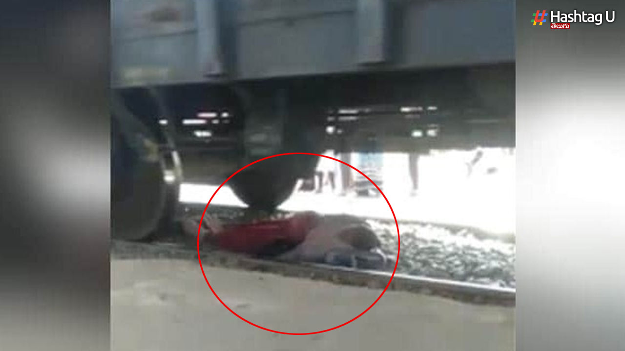The train moved while crossing the tracks.. The woman missed the accident