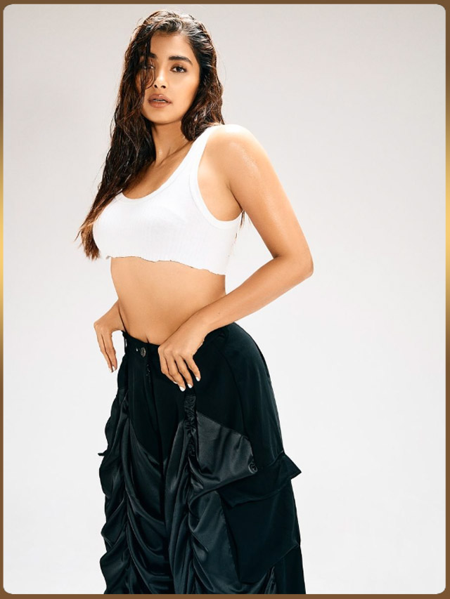 Pooja Hegde looks gorgeous as ever in a basic white crop top and balloon pants