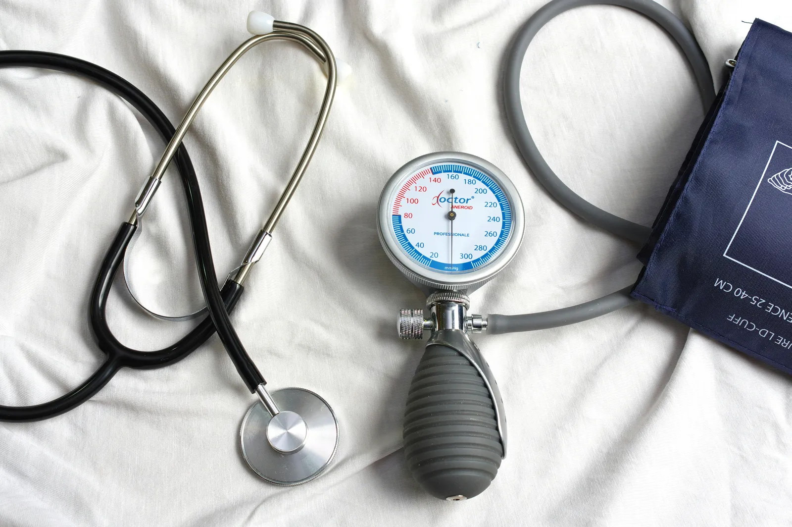 Stethoscope lies beside a blood pressure cuff