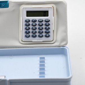 Double sided magnetic geometry box with calculator
