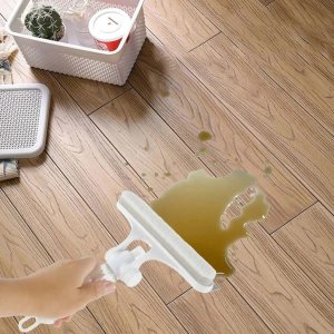 Multifunctional Glass Maintenance Tool Which is a versatile 4-in-1 device featuring a glass scraper, window glass wiper with integrated watering