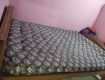 A solid queen size bed with heavy cotton mattress available for sale